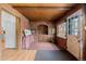Brick sunroom with a wood ceiling and plenty of natural light at 40 Colorado Blvd, Denver, CO 80206