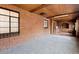 Spacious sunroom featuring exposed brick and a wood plank ceiling at 40 Colorado Blvd, Denver, CO 80206