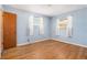 Bright bedroom with hardwood flooring, natural light, and neutral wall paint, a calming retreat at 6185 Sheridan Blvd, Arvada, CO 80003