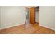 Bedroom featuring wood floors, doors, and a closet, ready for personalization at 6185 Sheridan Blvd, Arvada, CO 80003