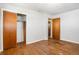 Bedroom featuring wood floors, doors, and a closet, ready for personalization at 6185 Sheridan Blvd, Arvada, CO 80003