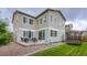 Spacious backyard with a patio, dining set, and trampoline at 6883 E 132Nd Pl, Thornton, CO 80602