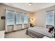 Bedroom featuring three windows, and a striped comforter at 6883 E 132Nd Pl, Thornton, CO 80602