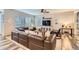 Spacious living room features a large sofa and ceiling fan at 6883 E 132Nd Pl, Thornton, CO 80602