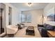 Cozy living room with modern decor and ample natural light at 6883 E 132Nd Pl, Thornton, CO 80602
