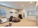 Loft area featuring a desk, a comfortable chair, and a TV at 6883 E 132Nd Pl, Thornton, CO 80602