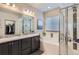 Main bathroom features a soaking tub, double sinks, and a walk-in shower at 6883 E 132Nd Pl, Thornton, CO 80602