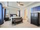 Spacious main bedroom features a tray ceiling, a ceiling fan, and ample natural light at 6883 E 132Nd Pl, Thornton, CO 80602