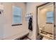 Mud room features storage, a bench, and access to a half bathroom at 6883 E 132Nd Pl, Thornton, CO 80602
