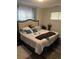 Cozy bedroom featuring a plush queen-size bed and neutral decor at 9041 Lilly Ct, Thornton, CO 80229