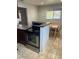 Modern kitchen featuring a stainless steel oven and eat-in dining area at 9041 Lilly Ct, Thornton, CO 80229