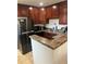 Well-equipped kitchen featuring stainless steel appliances and counter seating at 9041 Lilly Ct, Thornton, CO 80229
