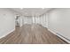 Spacious finished basement featuring vinyl flooring, neutral paint, and multiple entryways at 741 S 6Th Ave, Brighton, CO 80601