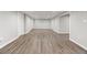 Finished basement with neutral paint and durable wood-look flooring, ideal for versatile living at 741 S 6Th Ave, Brighton, CO 80601