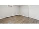 Basement bedroom with vinyl flooring, white trim, and a window for natural light at 741 S 6Th Ave, Brighton, CO 80601