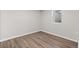 Bright bedroom featuring wood floors, a window, and neutral-colored walls at 741 S 6Th Ave, Brighton, CO 80601