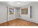 Bright bedroom featuring hardwood floors, ample natural light, and neutral wall color at 741 S 6Th Ave, Brighton, CO 80601