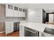 Updated kitchen features modern cabinetry, wine storage, and stainless steel appliances at 741 S 6Th Ave, Brighton, CO 80601