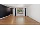 Spacious living room with hardwood floors and a large window allowing ample natural light at 741 S 6Th Ave, Brighton, CO 80601