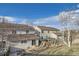 Backyard view featuring a wooden deck and fenced yard in a residential neighborhood at 22150 E Berry Pl, Aurora, CO 80015