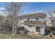 Exterior backyard view showing a fenced yard and patio area at 22150 E Berry Pl, Aurora, CO 80015