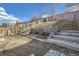 Multi-tiered backyard featuring landscaped terraces and a newly installed stone path at 22150 E Berry Pl, Aurora, CO 80015