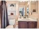 Bathroom featuring a vanity, toilet, and linen closet at 22150 E Berry Pl, Aurora, CO 80015