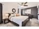 Well-appointed bedroom featuring a bed, nightstand, and gray accent wall at 22150 E Berry Pl, Aurora, CO 80015