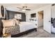 Comfortable bedroom with a ceiling fan, neutral-colored walls, and carpet flooring at 22150 E Berry Pl, Aurora, CO 80015