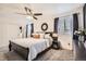 Inviting bedroom featuring a bed, ceiling fan, and window with natural light at 22150 E Berry Pl, Aurora, CO 80015