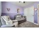 A bright and inviting Bedroom with a gray crib and plush seating arrangement at 22150 E Berry Pl, Aurora, CO 80015