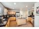 Kitchen featuring wooden cabinets, granite countertops, and a stainless steel refrigerator and appliances at 22150 E Berry Pl, Aurora, CO 80015