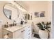 Bright bathroom featuring a dual sink vanity with marble countertop and modern fixtures at 8334 Pebble Creek Way # 201, Highlands Ranch, CO 80126
