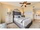 Comfortable bedroom featuring a plush bed, neutral-colored walls, and matching nightstands at 8334 Pebble Creek Way # 201, Highlands Ranch, CO 80126