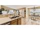 Bright kitchen overlooking the living and dining areas, with a double sink and modern appliances at 8334 Pebble Creek Way # 201, Highlands Ranch, CO 80126