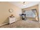 Home office with a ceiling fan, a large window, and a comfortable workspace at 8334 Pebble Creek Way # 201, Highlands Ranch, CO 80126
