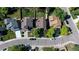 Aerial view showcasing the home's position on a tree-lined street at 728 Poppywood Pl, Highlands Ranch, CO 80126