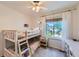 Charming bedroom with bunk beds, natural light, and a cheerful atmosphere at 728 Poppywood Pl, Highlands Ranch, CO 80126