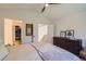 Comfortable bedroom with dresser, walk-in closet and neutral colors at 728 Poppywood Pl, Highlands Ranch, CO 80126
