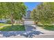 Charming two-story home with a well-maintained lawn, mature trees, and a two-car garage at 728 Poppywood Pl, Highlands Ranch, CO 80126