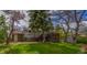 The exterior of the home features a large backyard with a deck and shed at 790 Mohawk Dr, Boulder, CO 80303