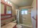 The bathroom features a shower-tub combo, a mirror, and a sink with drawers and cabinet at 790 Mohawk Dr, Boulder, CO 80303