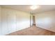 This bedroom has a large closet, neutral walls and neutral carpet at 790 Mohawk Dr, Boulder, CO 80303