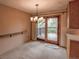 Dining room with neutral tones, carpet flooring, sliding door to deck, and modern lighting at 790 Mohawk Dr, Boulder, CO 80303