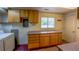 This laundry room includes cabinetry, countertops, a sink, and a washer and dryer at 790 Mohawk Dr, Boulder, CO 80303