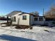 Side view of a white mobile home with black trim at 7070 Henry St, Fort Lupton, CO 80621