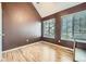 This bedroom features high ceilings, two large windows, and a new floor at 836 S Vance St # D, Lakewood, CO 80226