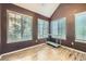 This bedroom features high ceilings, three large windows, and a new floor at 836 S Vance St # D, Lakewood, CO 80226