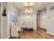 Cozy dining nook with a unique corner bench and stylish light fixture at 836 S Vance St # D, Lakewood, CO 80226