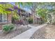 Charming multi-story building with brick facade, balconies, and landscaped surroundings for attractive curb appeal at 836 S Vance St # D, Lakewood, CO 80226